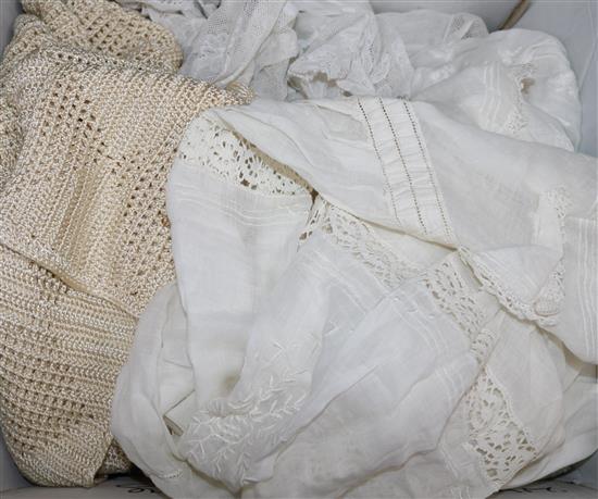 An Edwardian white worked blouse, 1920s silk jumper and two petticoats